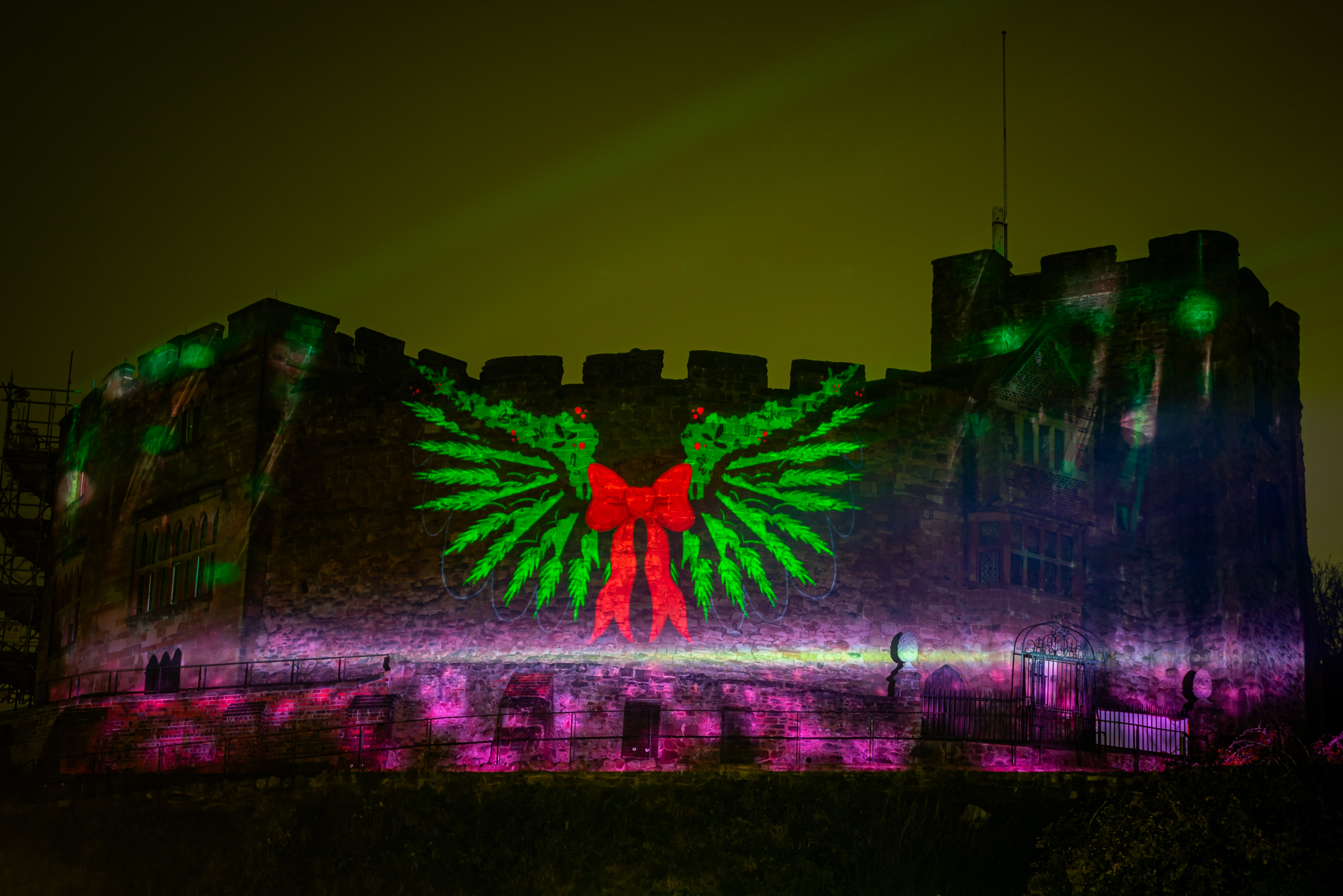 castle with outside projection on the wall and bright lights 