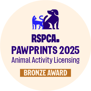 Bronze paw print award logo