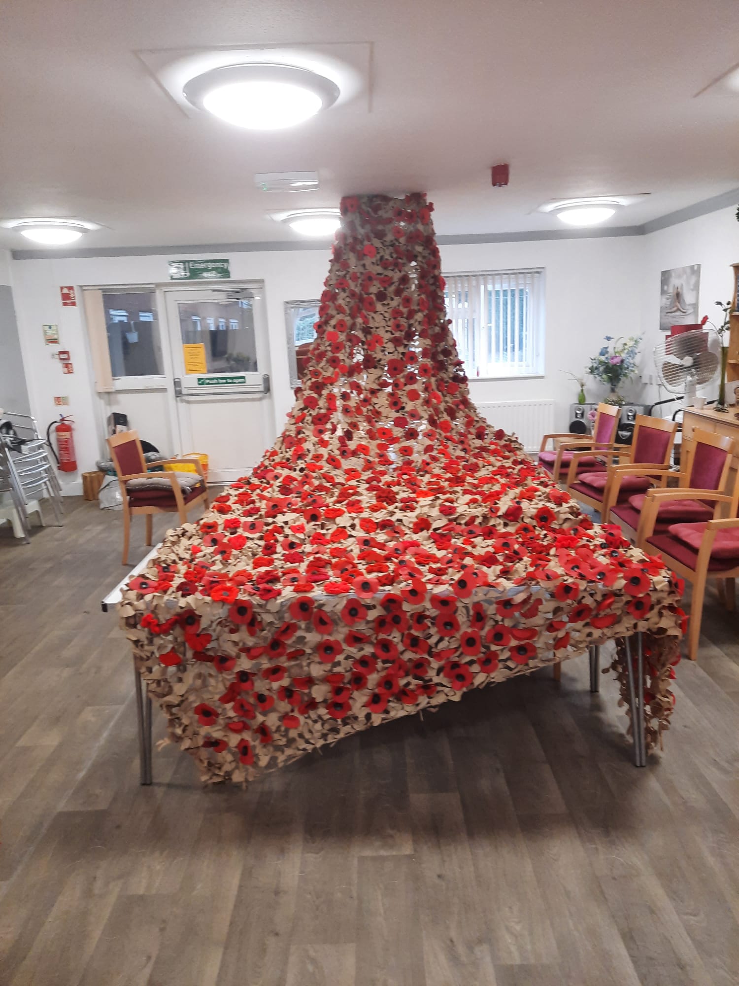 photo of a large poppy crafted display on a large table 