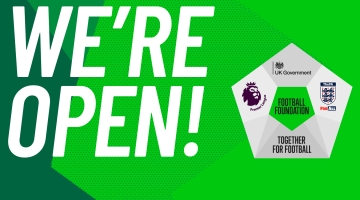 graphic with green background, FA logo and large white writing saying 'We're open'..