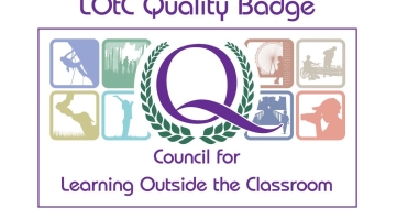 logo for LOtC badge showing a white background and a purple centre Q 