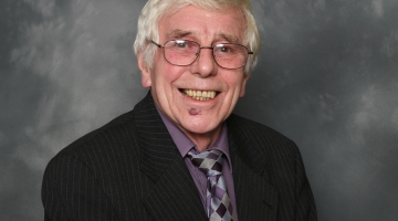 Ron Cook in a suit